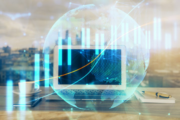 Stock market chart hologram drawn on personal computer background. Multi exposure. Concept of...