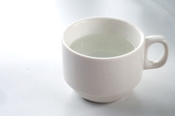 warm water in white cup and space for write wording