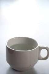 Warm water in white cup and space for write wording