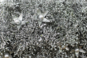 Christmas decoration background texture. Silver branches artificial festive decor abstraction