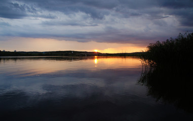Sunset on the city lake in the evening.
