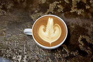 Cappuccino coffee on table in coffee shop