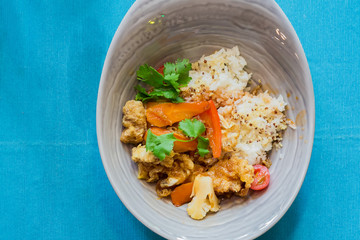 asian cuisine - sweet and sour pork on rice with vegetables. Top view