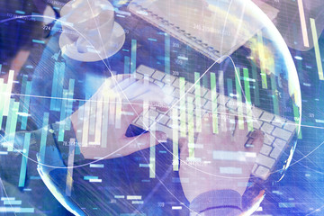 Fototapeta na wymiar Double exposure of businessman working on laptop on background. International business hologram in front. Concept of success.