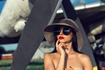 Brunette in a dress at the old airport
