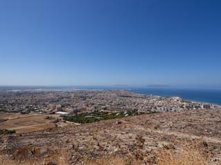 Fototapeta na wymiar Distant view of the city of Trapani, Sicily with the Isole Egadi islands in the far distance