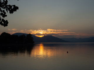 Sunset at Lago d'Iseo or Lake Iseo, Italian Lakes area, showing peaceful setting and location