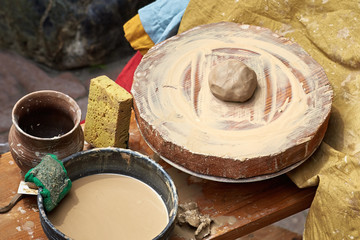 Closeup of a pottery wheel with a piece of clay