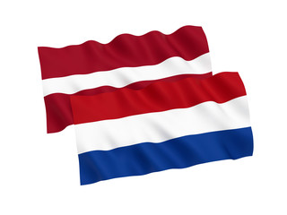 National fabric flags of Netherlands and Latvia isolated on white background. 3d rendering illustration. Proportion 1:2