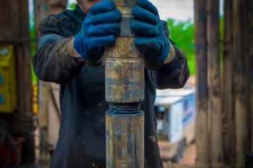 Offshore oil rig worker prepare tool and equipment for perforation oil and gas well at wellhead...