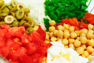 Real food, vegetable salad with peppers, tomatoes, onion and olives