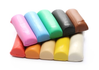 Colorful plasticine for modelling isolated on white background