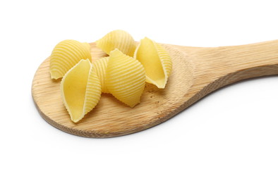 Conchiglie grandi pasta with wooden spoon isolated on white background