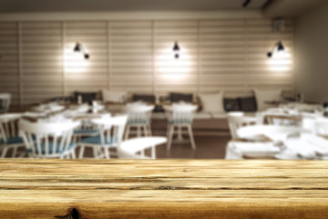 Desk of free space and blurred background of interior 