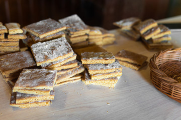 crunchy bread on a wooden background in rustic style, next to the basket.
