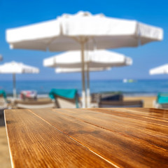 Desk of free space and beach background 