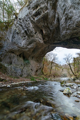 Limestone tunnel over river