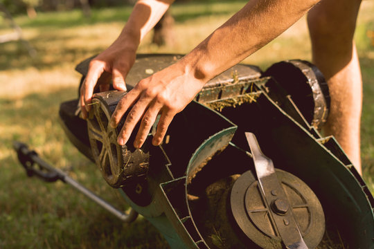 Gardener Repair And Fix The A Lawn Mower In Garden