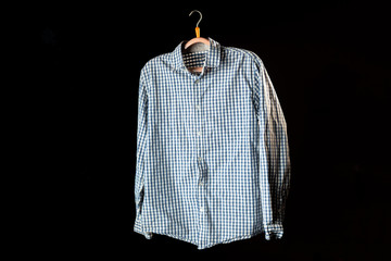 casual checkered shirt on a hanger flying on a dark background mockup design