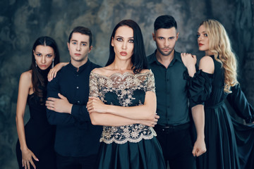 Group of young beautiful people posing in studio