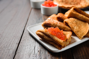 Russian pancakes blini with red caviar