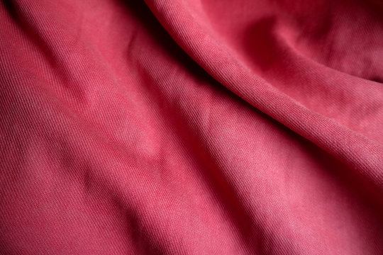 Red textile background with texture