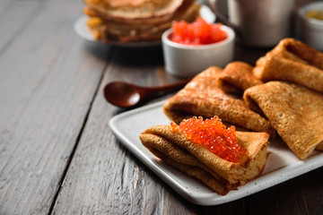 Russian pancakes blini with red caviar