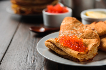 Russian pancakes blini with red caviar