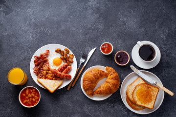 Classical english breakfast with fried bacon, mushrooms and eggs. Served with orange juice and black coffee.