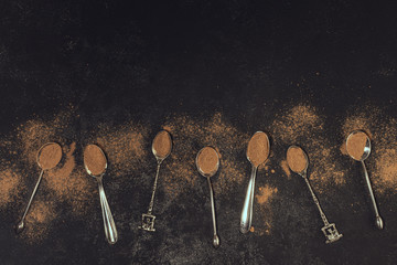 Coffee spoons on black background