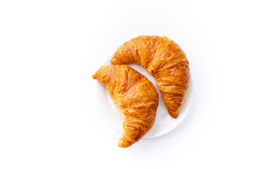 Top view flatlay with two fresh croissants. Morning meal concept. White background