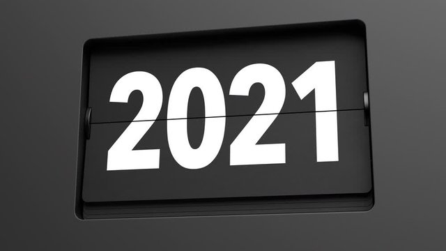 2020 - 2021. A flip clock calendar turns slowly from year 2020 to 2021. New Year / turn of the year concept. Ultra slow motion. High quality 3d animation.