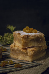 Tasty raisin pie with black background