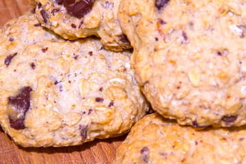 close-up oatmeal cookie with pieces of chocolate