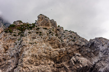Italy, Capri, view of the coast seen from the sea.