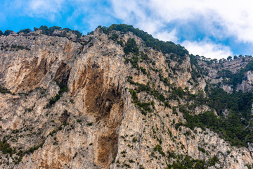 Italy, Capri, view of the coast seen from the sea.
