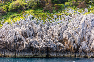 Italy, Capri, view of the coast seen from the sea.