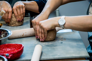 rolling clay on the board