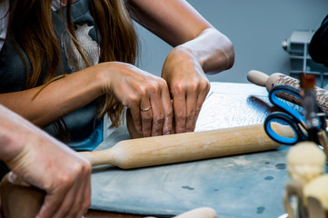 rolling clay on the board