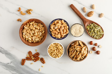 Close-up view of different types of nuts in bowls
