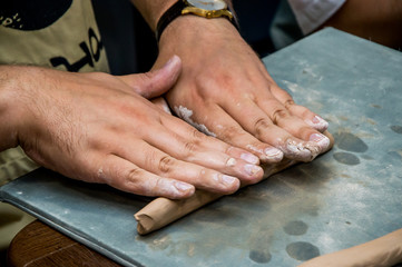 rolling clay on the board