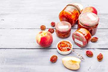 White peach jam, confiture, chutney in a glass jar
