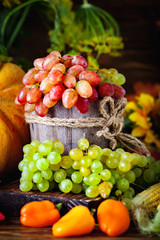 The table, decorated with vegetables and fruits. Harvest Festival. Happy Thanksgiving. Autumn background. Selective focus.