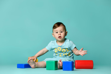little boy child toddler playing with block toys
