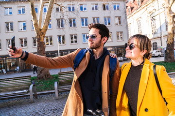 Interracial young couple takes selfie on date