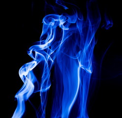 Blue smoke on black background
