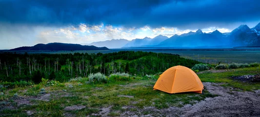 Fotobehang Tent on a ridge with approaching stom. © Patrick Jennings