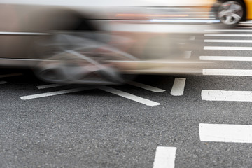 Crossing cars on the road closeup