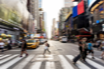 Blurred people crossing the street
