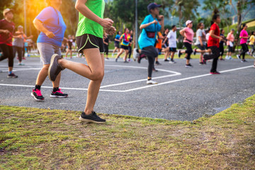  Group people workout exercise with dancing a fitness dance or aerobics in city park